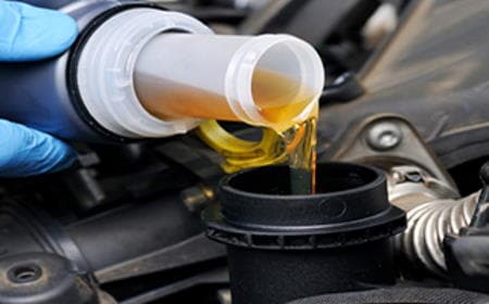 Our garage and workshop are equipped to service all makes and models of cars and commercial vehicles Becra Auto Care replacing a customers oil